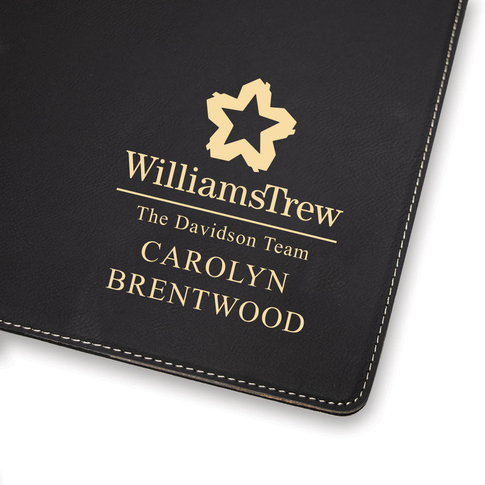 Custom engraved gold on black portfolio branded Williams Trew logo