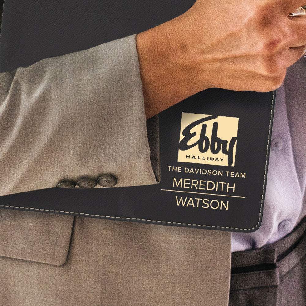 Custom engraved gold on black portfolio branded Ebby Halliday logo