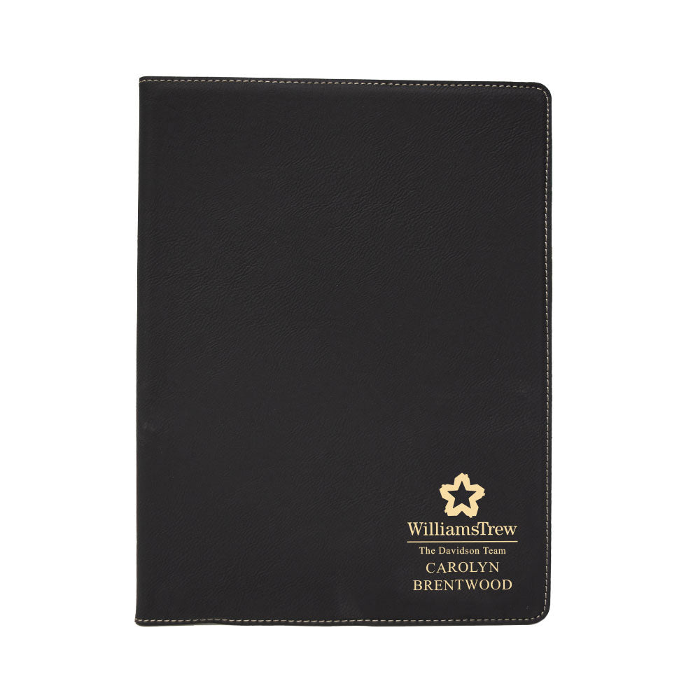 Custom engraved gold on black portfolio branded Williams Trew logo