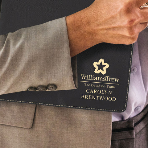 Custom engraved gold on black portfolio branded Williams Trew logo